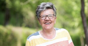 smiling female senior looking for moving services