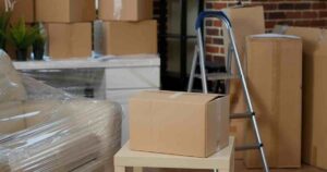 African American couple using cardboard boxes with commercial moving companies.