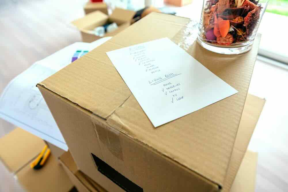 Closeup of a checklist on a box to organize for cross-country moves.