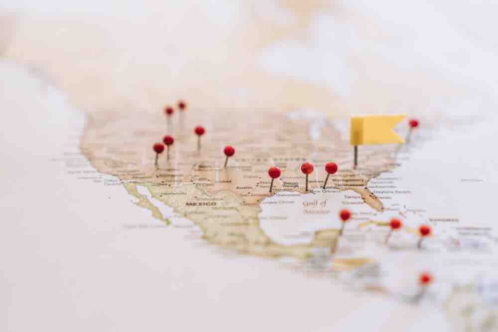 United States map with red pins representing cross-country moves.