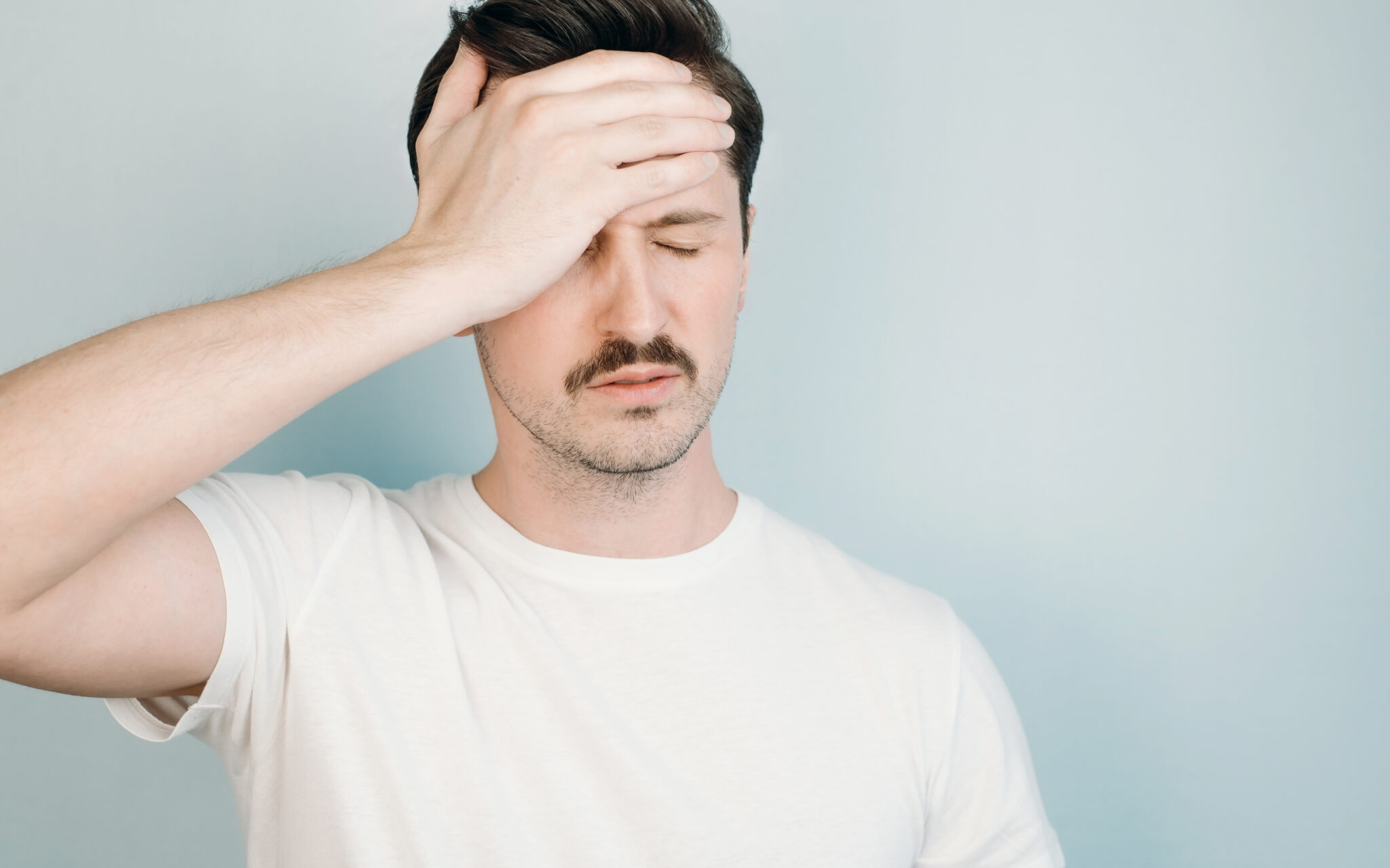 Frustrated man who overlooked moving tasks without a moving checklist.