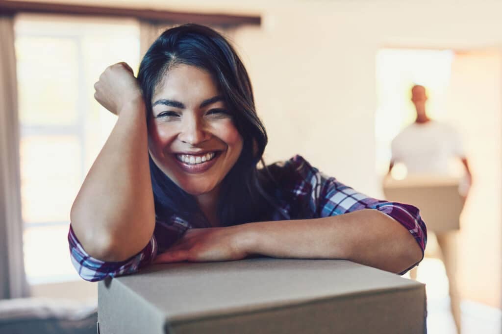 A smiling woman who is happy with service from Texas movers.