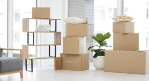 Boxes stacked in an airy room, packed following cost-effective moving strategies.
