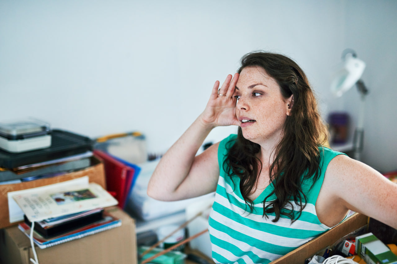 Stressed woman wondering how to settle into a new community.