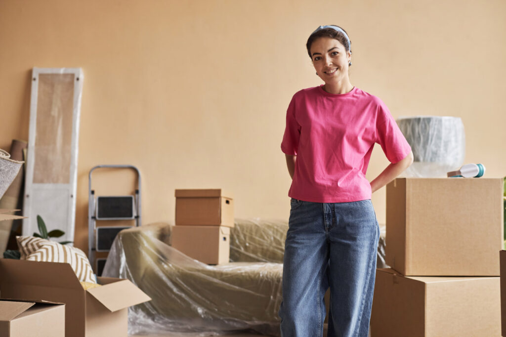 Woman in pink protecting irreplaceable items during a move with expert packing.
